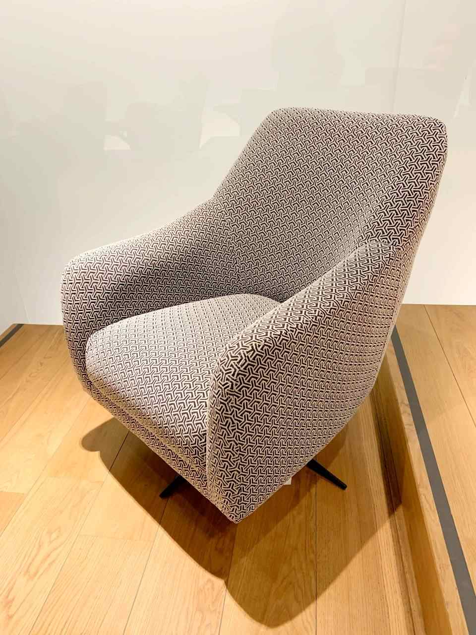 grey armchair with black pattern