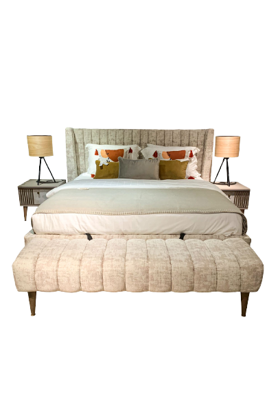 king sized light beige bed and ottoman
