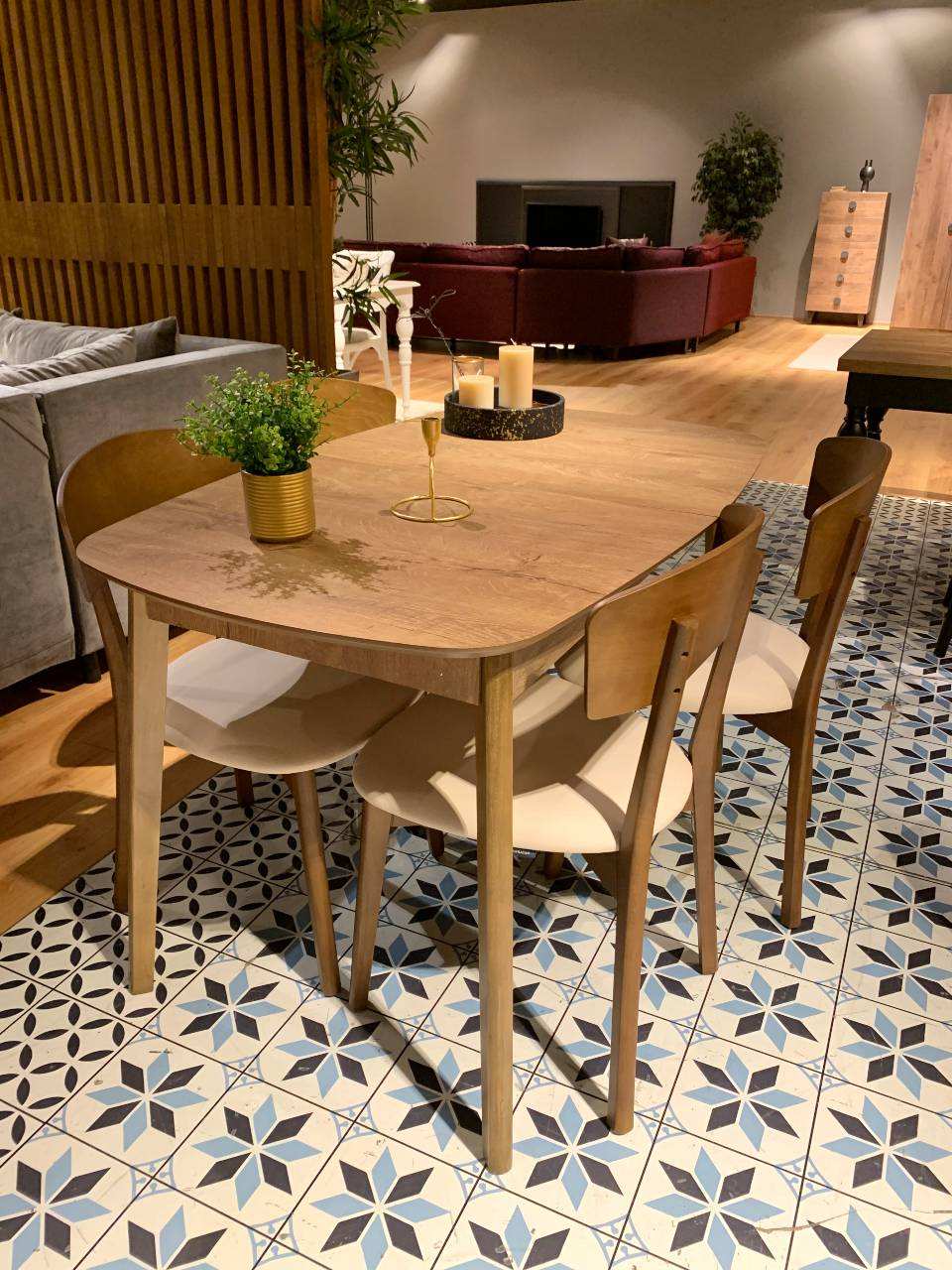 light brown wooden dining table with four brown beige chairs