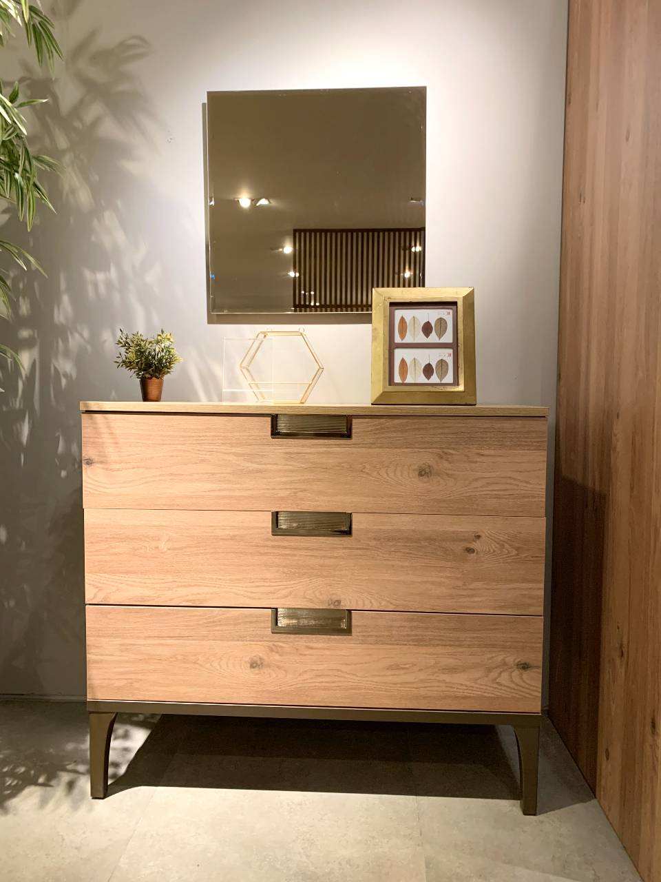 brown dresser with gold brown details