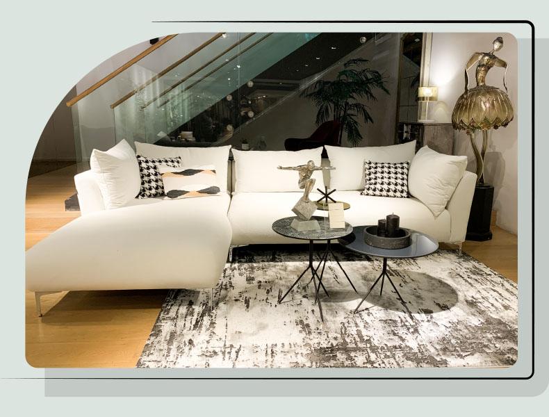 big white couch and decor on two side tables