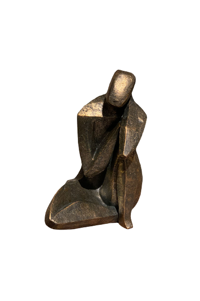 metallic sculpture of a person sitting